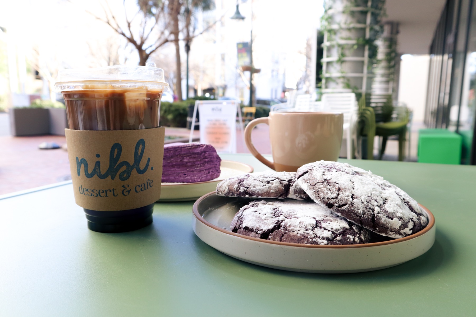 Purple ube crinkle cookies dusted with powdered sugar.